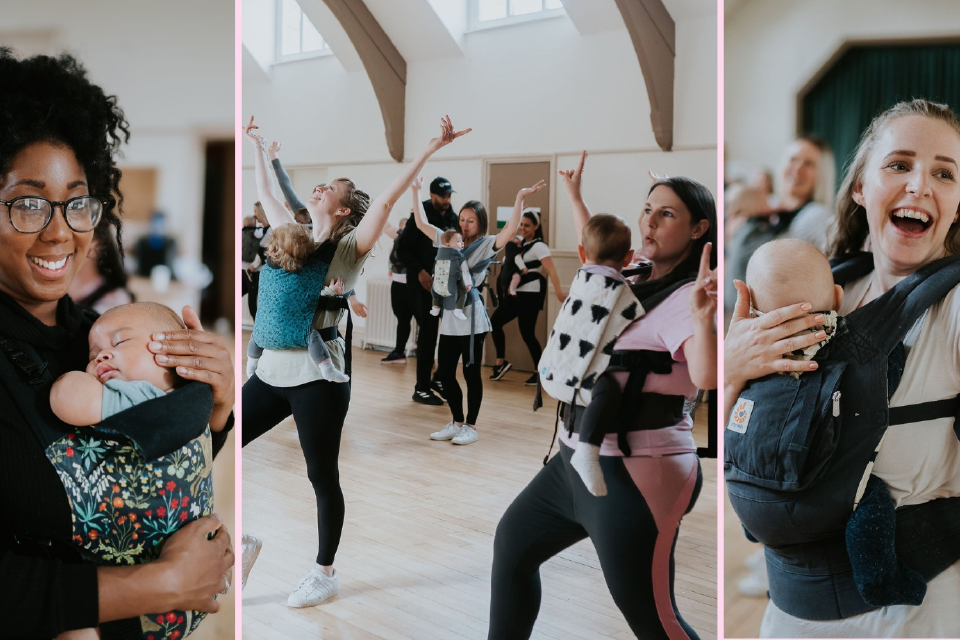 Photo of a group of Mums wearing babies in carriers, dancing.