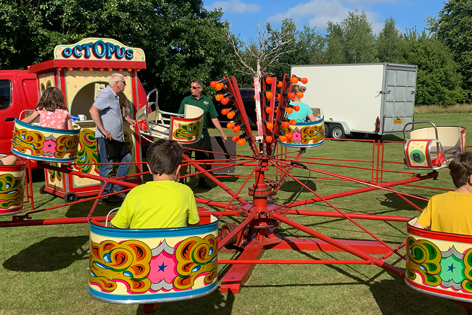 Photo showing traditional fairground small spinning ride